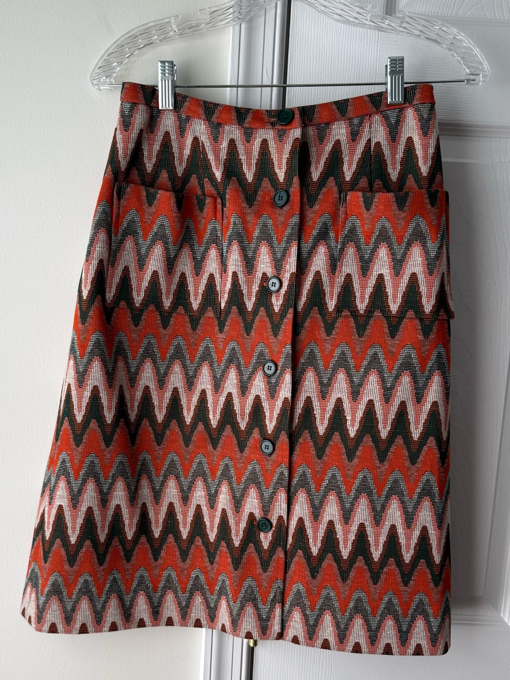 Vintage Haymaker chevron patterned mini skirt with button front. Size: 12